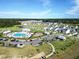 Community aerial view showcasing a swimming pool, playground, clubhouse, and surrounding neighborhood in lush greenery at 4407 Palm Shadow Dr, Summerville, SC 29485