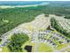 An aerial view of a Primary-planned community featuring numerous homes surrounded by lush forestry at 4407 Palm Shadow Dr, Summerville, SC 29485