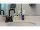 A closeup of a bathroom features a matte black faucet, a sink and a mirror at 4407 Palm Shadow Dr, Summerville, SC 29485