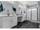 Bright bathroom features double vanities, a vanity area, and a glass enclosed shower at 4407 Palm Shadow Dr, Summerville, SC 29485