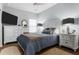 A comfortably designed bedroom features hardwood floors, dresser, lamps and a blue comforter at 4407 Palm Shadow Dr, Summerville, SC 29485