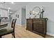 Stylish entryway featuring wood floors, decorative console table, and elegant decor with plenty of natural light at 4407 Palm Shadow Dr, Summerville, SC 29485