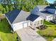 Beautiful home featuring a two-car garage, a covered front porch, and tasteful landscaping at 4407 Palm Shadow Dr, Summerville, SC 29485