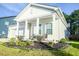 Charming front porch with tasteful seating and landscaping welcomes you home at 4407 Palm Shadow Dr, Summerville, SC 29485