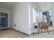 Inviting front porch with comfortable seating area with two chairs enhances the curb appeal of this home at 4407 Palm Shadow Dr, Summerville, SC 29485
