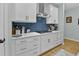 Kitchen featuring a gas range, white cabinets, and decorative backsplash at 4407 Palm Shadow Dr, Summerville, SC 29485