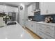 Bright kitchen featuring white cabinets, stainless steel appliances, and modern backsplash at 4407 Palm Shadow Dr, Summerville, SC 29485