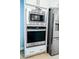 This kitchen showcases stainless steel appliances, including an oven and a microwave at 4407 Palm Shadow Dr, Summerville, SC 29485