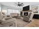 Comfortable living room featuring a fireplace and a large-screen television at 4407 Palm Shadow Dr, Summerville, SC 29485