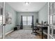 This office has a window, desk, office chair, and neutral-colored walls and carpet at 4407 Palm Shadow Dr, Summerville, SC 29485
