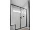 Glass enclosed shower with white tiled walls and a built-in bench at 4407 Palm Shadow Dr, Summerville, SC 29485