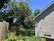Backyard view showing fence, garden, lawn and siding of home at 4504 Winterwood Pl, Ladson, SC 29456