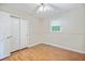 Bedroom with wood floor features window, closet, and ceiling fan at 4767 June St, North Charleston, SC 29405
