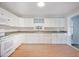 Clean kitchen with white cabinets, granite countertops, and modern appliances, ready for cooking at 4767 June St, North Charleston, SC 29405