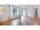 Inviting living room with wood floors, a front door entrance, and a hallway view, offering comfort at 4767 June St, North Charleston, SC 29405
