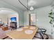 Comfortable dining room with seating for six next to living room and updated kitchen at 5028 Victoria Ave, North Charleston, SC 29405