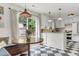 Updated kitchen with modern appliances connects to a breakfast nook and sliding glass door at 5028 Victoria Ave, North Charleston, SC 29405
