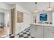 Breakfast nook with checkerboard floors is conveniently off of the bright and modern kitchen at 5028 Victoria Ave, North Charleston, SC 29405