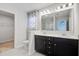 Bathroom featuring double vanity, large mirror, and black and white color scheme at 515 Purple Finch Rd, Summerville, SC 29486