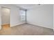 Well-lit bedroom features neutral carpet and access to walk-in closet at 515 Purple Finch Rd, Summerville, SC 29486