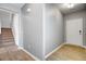 Inviting entryway with natural light, wood-look flooring and stairs leading to the second floor at 515 Purple Finch Rd, Summerville, SC 29486