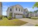 The home's exterior shows a two-car garage, manicured lawn, and tasteful landscaping at 515 Purple Finch Rd, Summerville, SC 29486