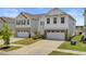 The home features a two-car garage, landscaped grounds, and a well-manicured lawn at 515 Purple Finch Rd, Summerville, SC 29486