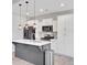 Stylish kitchen featuring a center island, white cabinetry, stainless appliances, and pendant lighting at 515 Purple Finch Rd, Summerville, SC 29486