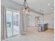 Open floor plan with luxury vinyl plank flooring, leading to the kitchen and dining area, and sliding glass door at 515 Purple Finch Rd, Summerville, SC 29486