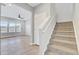 Carpeted stairs lead to the upper level, providing access from the living area at 515 Purple Finch Rd, Summerville, SC 29486