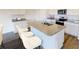 Modern kitchen with granite countertops, an island with barstools, and stainless steel appliances at 5304 Bending Flats Way, Summerville, SC 29485