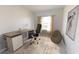 Home office space with a modern desk, comfortable chair, and a window for natural light at 5304 Bending Flats Way, Summerville, SC 29485