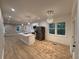 Open-concept kitchen with stainless steel appliances and a center island, perfect for entertaining at 5513 Blackwell Ave # A, North Charleston, SC 29406
