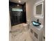 Updated bathroom featuring modern fixtures, tiled shower, and vanity with a vessel sink at 5513 Blackwell Ave # B, North Charleston, SC 29406