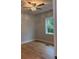 Bright bedroom with modern ceiling fan, light blue walls, new vinyl floors, base trim, and window at 5513 Blackwell Ave # B, North Charleston, SC 29406