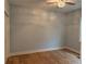 Light-filled bedroom with hardwood floors, overhead lighting, and fresh paint at 5513 Blackwell Ave # B, North Charleston, SC 29406