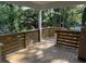 Spacious outdoor deck featuring wood railing and tree-lined backyard, perfect for relaxing and entertaining at 5513 Blackwell Ave # B, North Charleston, SC 29406