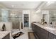 Modern bathroom featuring walk-in shower with glass door, double vanity and granite countertops at 6016 Wild Azalea Rd, Summerville, SC 29483