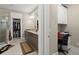Well-lit bathroom with double vanity, granite countertop, walk-in closet and glass shower at 6016 Wild Azalea Rd, Summerville, SC 29483