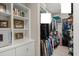 Spacious walk-in closet with custom shelving and ample storage for clothes, shoes, and personal belongings at 6016 Wild Azalea Rd, Summerville, SC 29483