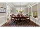 Charming dining room with traditional style, windows, and elegant lighting at 6016 Wild Azalea Rd, Summerville, SC 29483