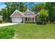 Charming single-Gathering home with an attached two car garage and well-manicured lawn at 6016 Wild Azalea Rd, Summerville, SC 29483