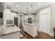 Well-appointed kitchen with granite counters, an island, and sleek appliances at 6016 Wild Azalea Rd, Summerville, SC 29483
