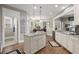 Well-lit kitchen boasts granite countertops, stainless appliances, and ample cabinet space at 6016 Wild Azalea Rd, Summerville, SC 29483