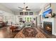 An inviting living room with fireplace, plenty of natural light, and an open floor plan at 6016 Wild Azalea Rd, Summerville, SC 29483