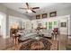 Spacious living room featuring hardwood floors, comfortable seating, and bright, natural light at 6016 Wild Azalea Rd, Summerville, SC 29483