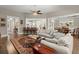 Open concept living room, featuring a large area rug and neutral decor at 6016 Wild Azalea Rd, Summerville, SC 29483