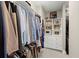 Walk-in closet, with rows of hanging clothes, drawers and shelves at 6016 Wild Azalea Rd, Summerville, SC 29483