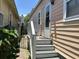 Back entrance of home with stairs, a small porch, a door and an iron fence at 7 Dingle St, Charleston, SC 29403