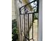 A gated backyard pathway with brick, greenery, and a wooden fence that encloses a small outdoor space at 7 Dingle St, Charleston, SC 29403